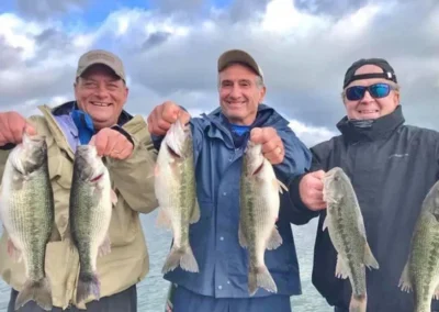 Group of anglers with bass caught on a fishing trip in Branson