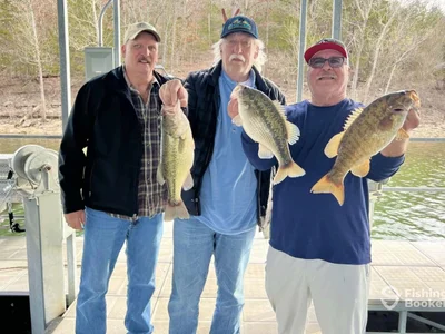 Group of anglers with bass caught on a guided fishing trip in Branson