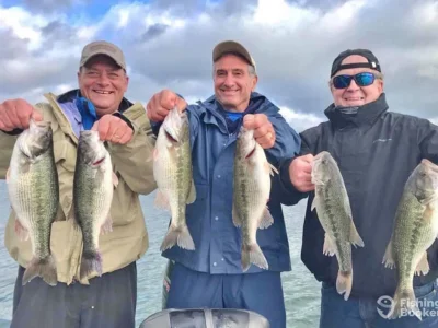 Successful bass fishing trip with anglers on the lake